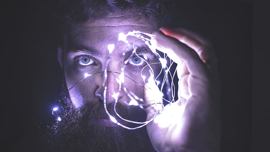 Person Holding String Lights Photo, black background, brain, close-up HD wallpaper