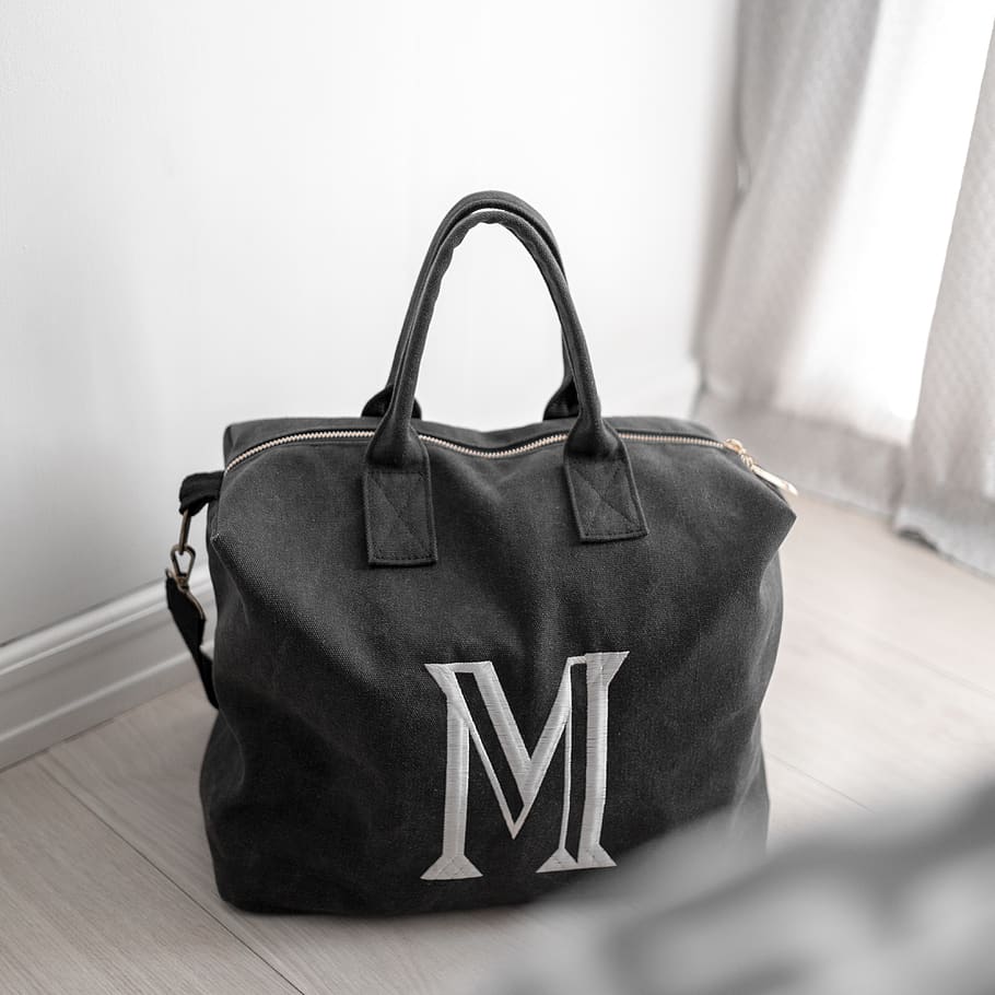 black tote bag, indoors, no people, close-up, focus on foreground
