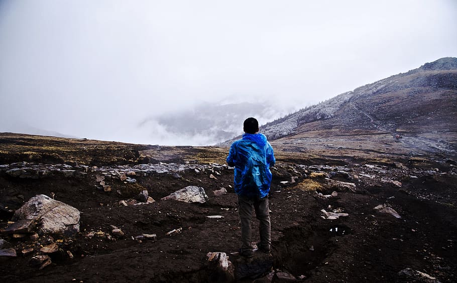 Person Overlooking White Clouds, adventure, back view, cold, daylight HD wallpaper