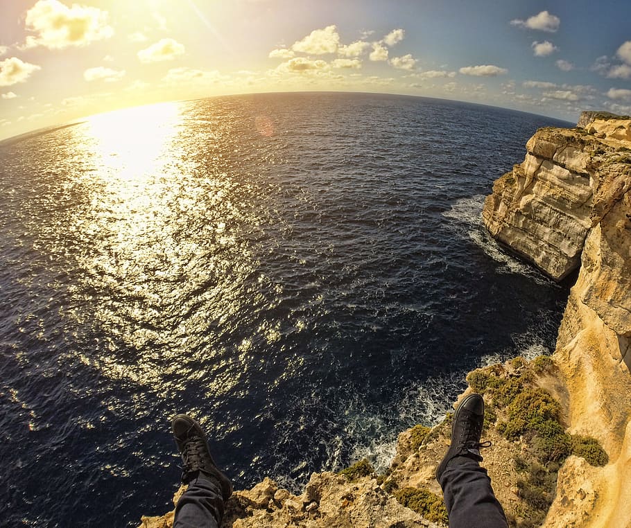 Person on Top of Stone Island in Front of Sea during Sunset, adventure HD wallpaper