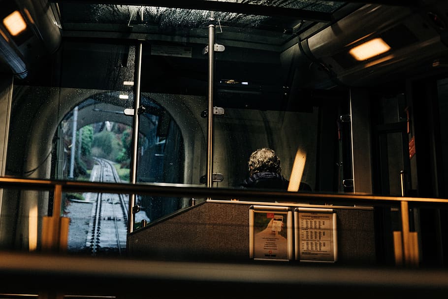 man inside train, indoors, interior design, lighting, person HD wallpaper