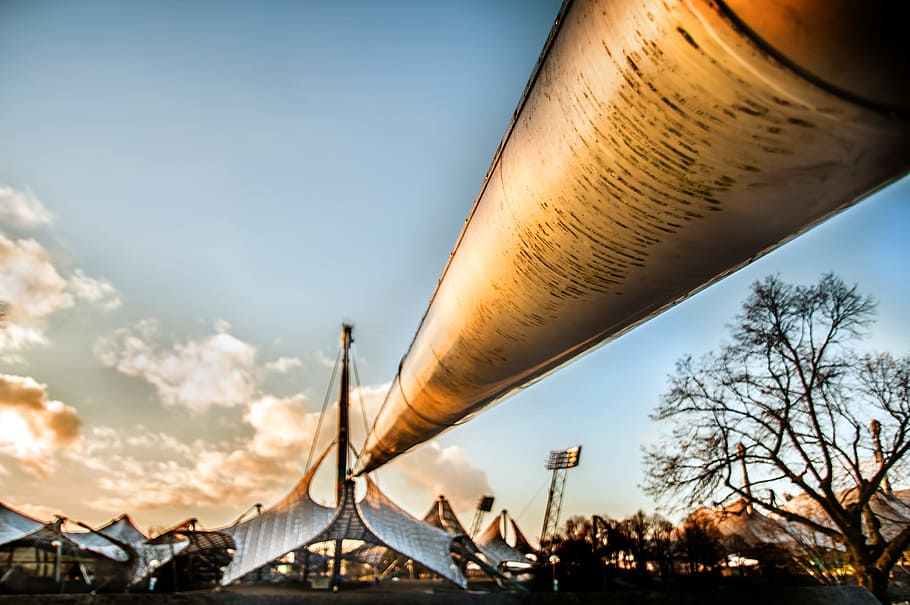 Tubes Leading to a City Low-angle Photo, buildings, clouds, daylight HD wallpaper