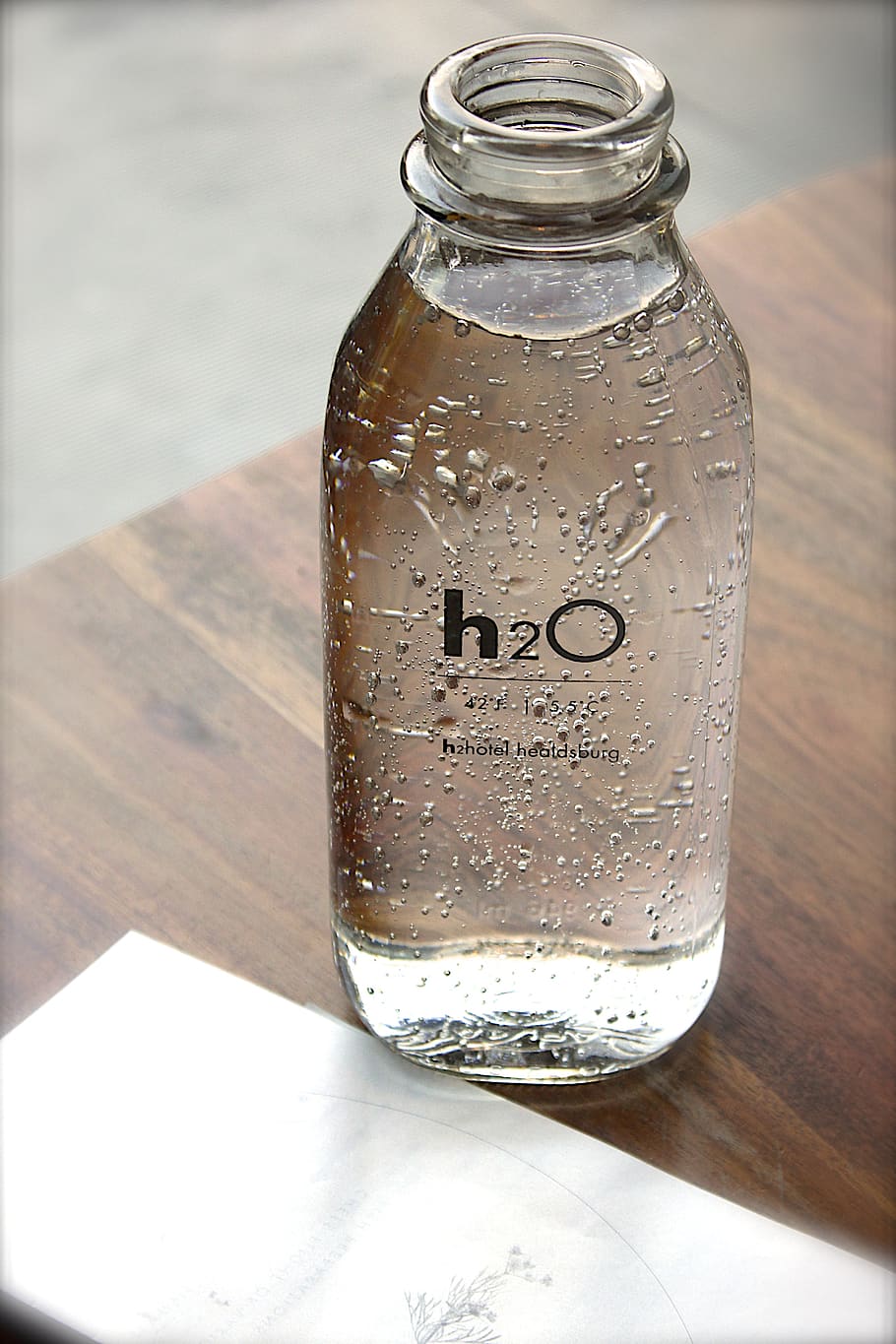 Clear Glass H2o Bottle, drink, hydrate, water, table, container