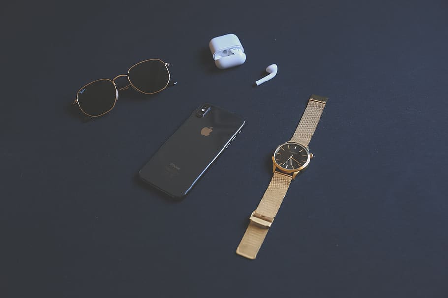 space gray iPhone X beside AirPods with case, round gold-colored analog watch and black sunglasses, HD wallpaper
