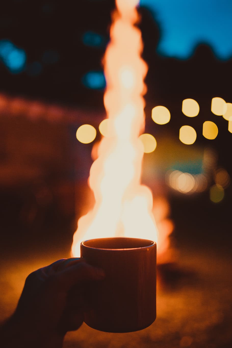 Photo of Person Holding Mug and Watching Bonfire, blurred background HD wallpaper
