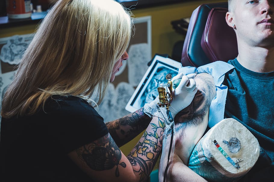 Woman Tattooing Man on His Right Arm, artist, creative, tatoo artist, HD wallpaper