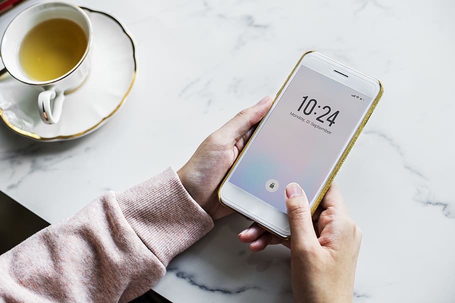 Photo of Person Using White Smartphone, break time, ceramic cup HD wallpaper