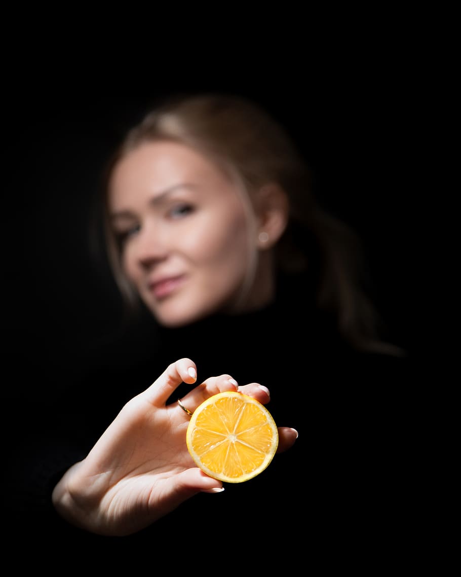 black background, citrus fruit, one person, slice, food, food and drink HD wallpaper