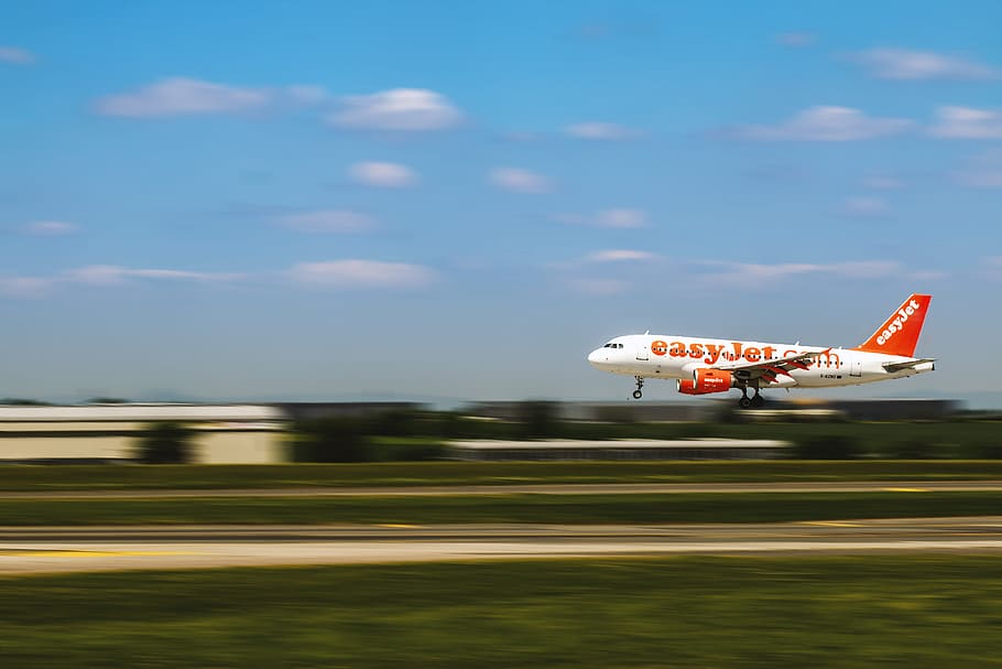 Airplane is landing at the airport in motion, air vehicle, transportation HD wallpaper
