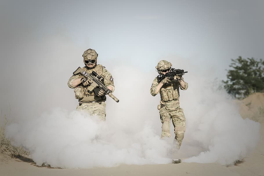 Men Holding Rifle While Walking Through Smoke Grenade, action