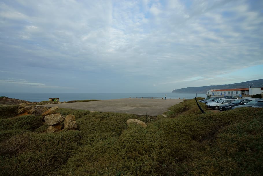 Parked Vehicle Near Body of Water Under Cloudy Sky, clouds, daylight HD wallpaper