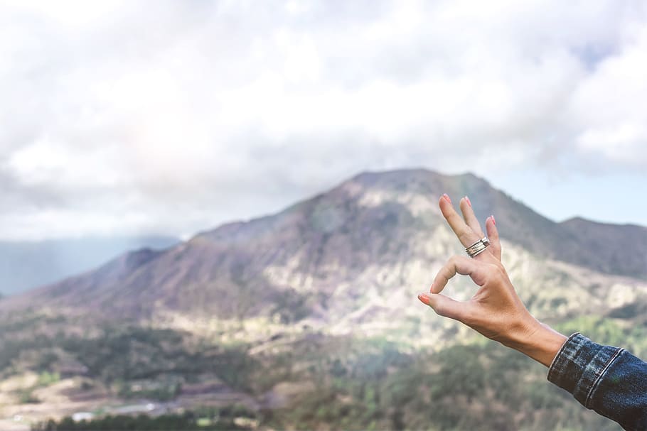 Person Showing Ok Hand Sign Overlooking Mountain, adventure, fingers