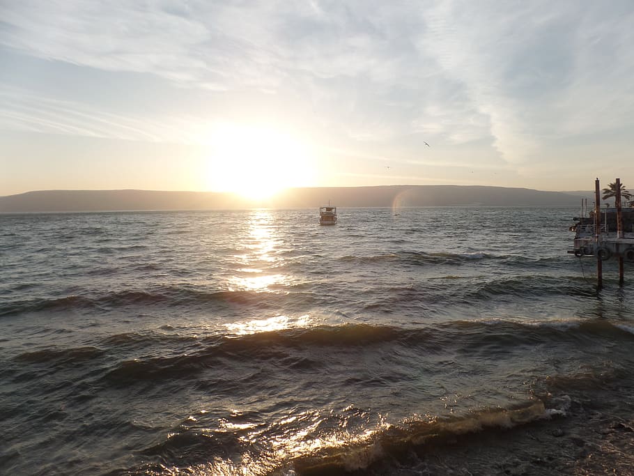A sunset in the horizon in an ocean in Israel., sea of galilee