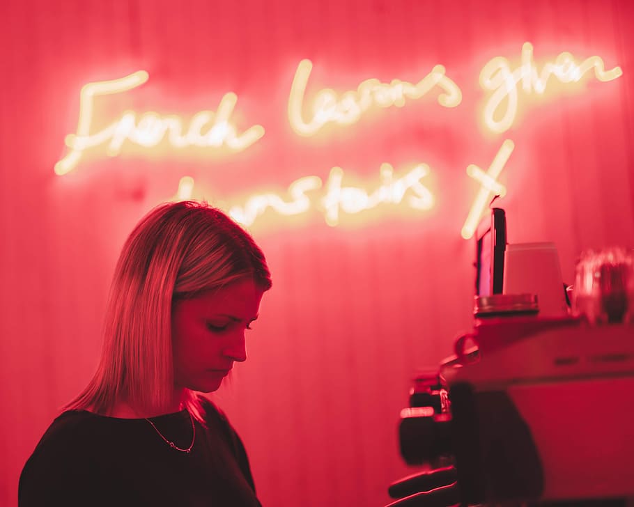 woman in black crew-neck top, neon, blonde, coffee, coffee shop