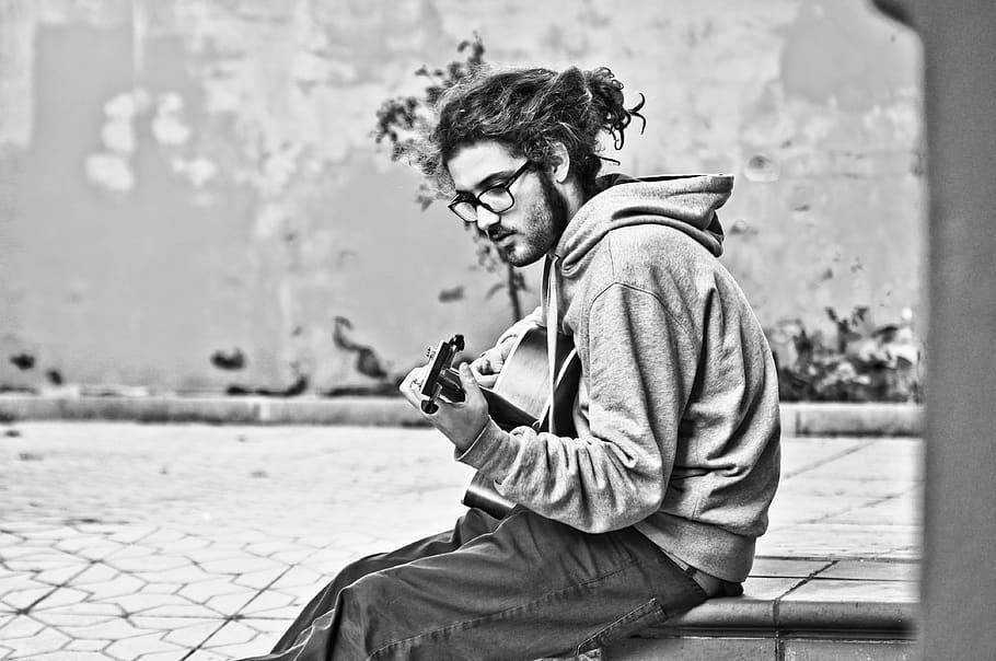 man playing guitar grayscale photo, person, human, photographer