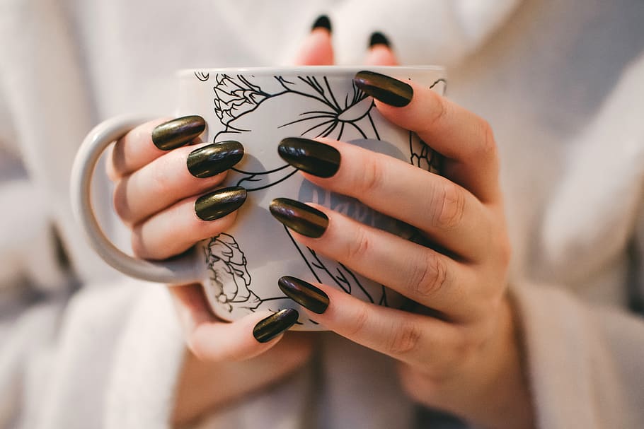 Woman With Black Manicure Holding White and Grey Floral Ceramic Cup HD wallpaper