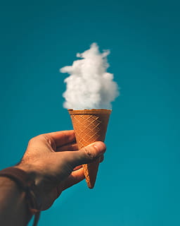 Man Holding Ice Cream Cone Under Cloud, clouds, conceptual, creative HD wallpaper