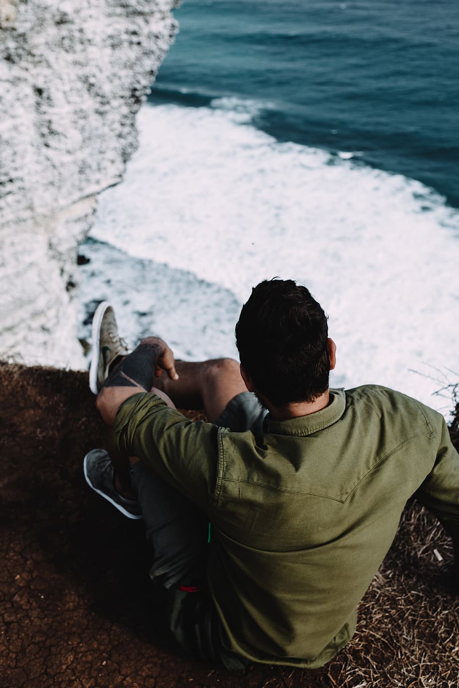 man sitting on rock formation, water, real people, leisure activity HD wallpaper