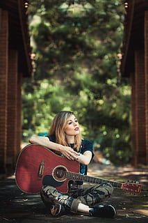 HD wallpaper: Woman Holding Red Guitar, activity, beautiful, blond hair,  blurred background | Wallpaper Flare