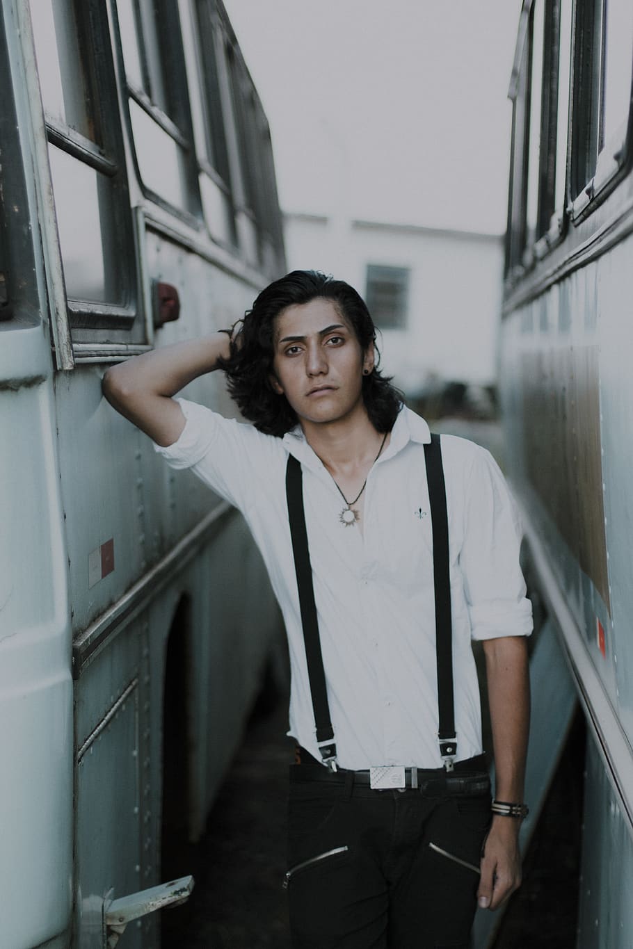 Photo of Man Standing Between Buses Posing, photoshoot, stare HD wallpaper