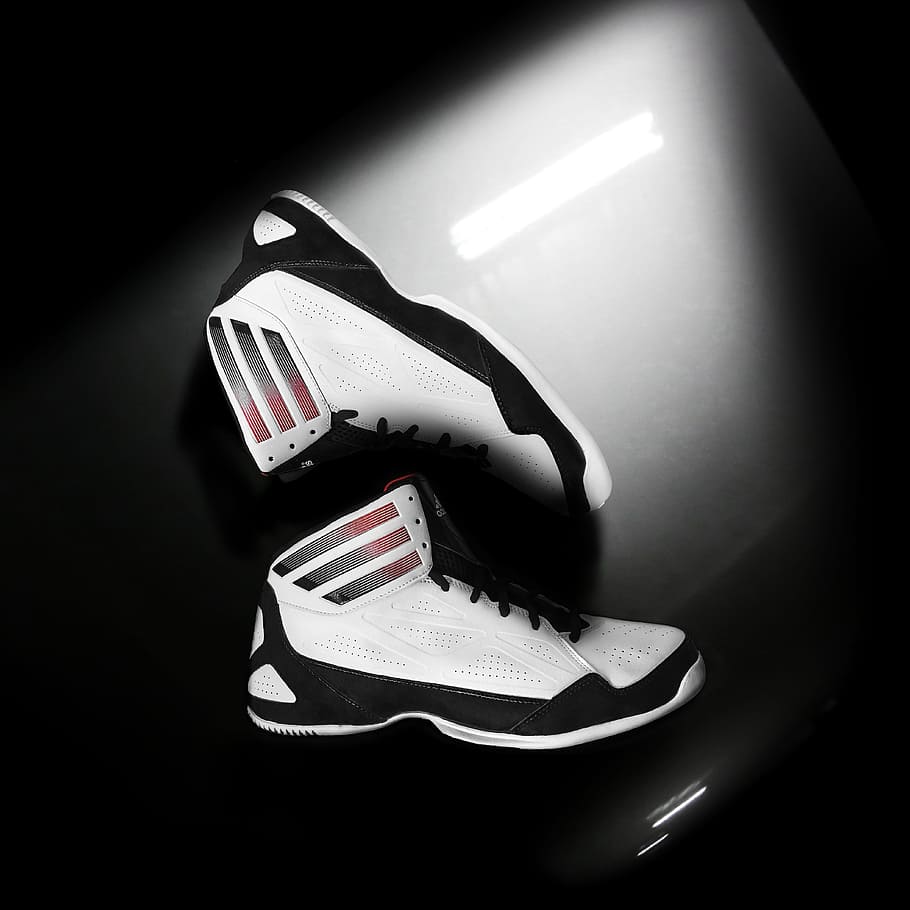 pair of white-and-black sneakers, shoe, studio, floor, brand