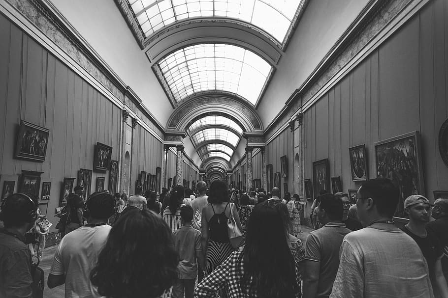 group of people inside museum in grayscale photography, human