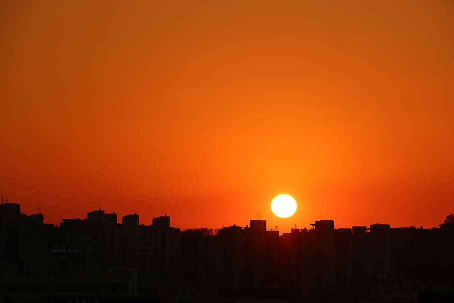 Silhouette Cityscape Against Romantic Sky at Sunset, backlit HD wallpaper