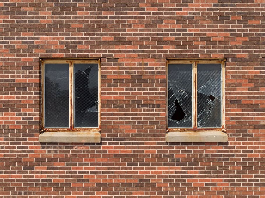 two broken glass building windows, derelict, abandoned, warehouse