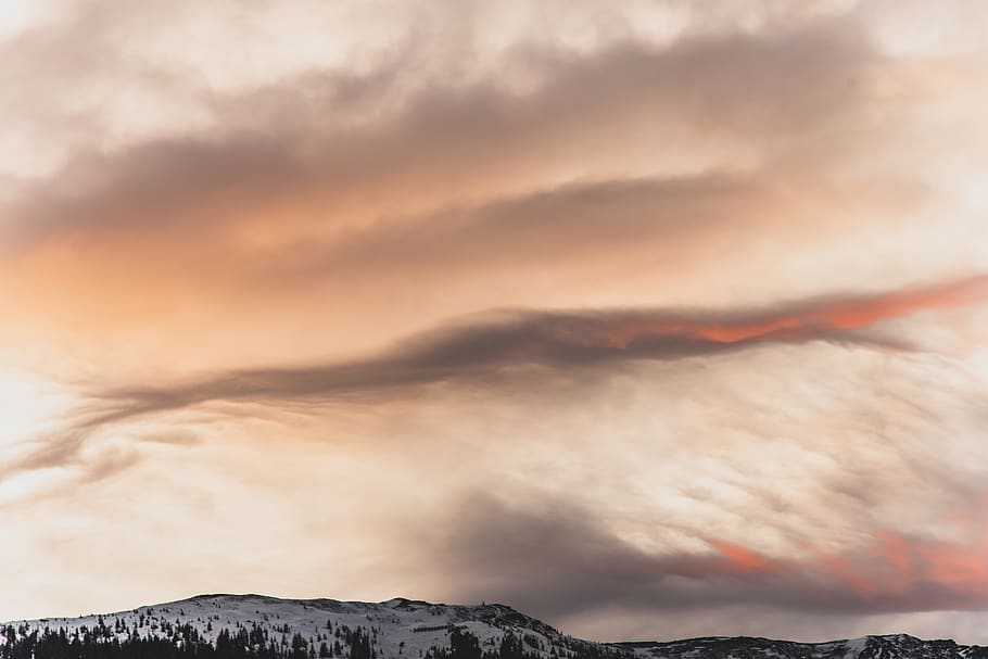 snow capped mountain under orange sky, nature, outdoors, weather HD wallpaper
