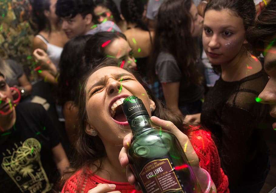 Woman Wearing Red Shirt Drinking, bottle, celebration, crowd HD wallpaper