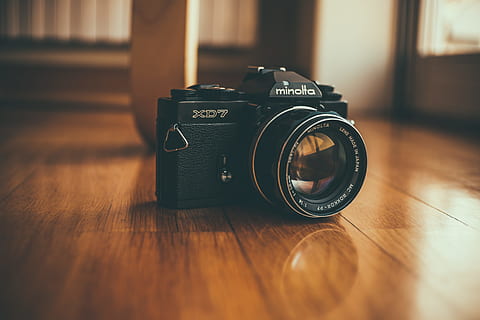 black Minolta SLR camera on brown wooden floor, 35mm, lens, film camera HD wallpaper