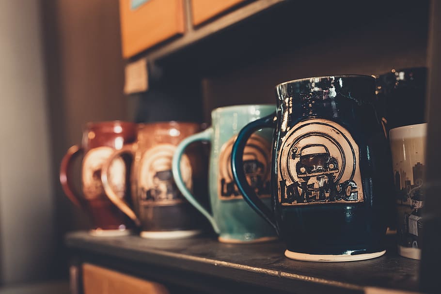 Selective Focus Photography Of Mugs, macro, shelf, indoors, drink HD wallpaper