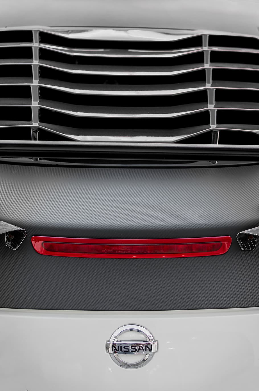Nissan emblem, no people, metal, close-up, motor vehicle, indoors HD wallpaper