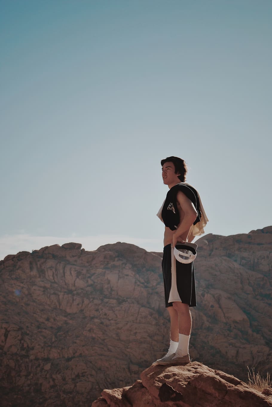 man standing on r, shorts, clothing, apparel, human, person, outdoors HD wallpaper