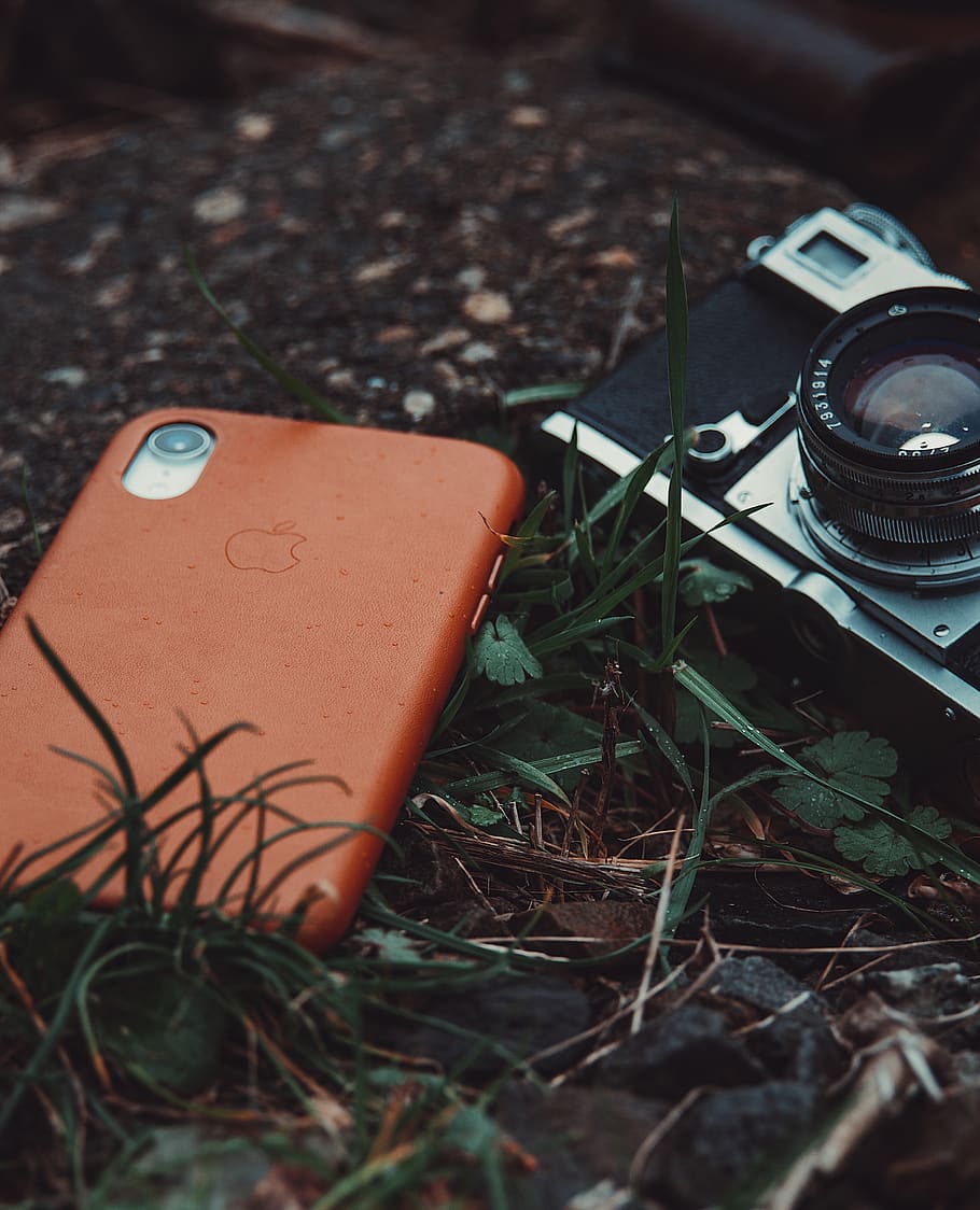 red iPhone and gray film camera on grasses closeup photography, HD wallpaper