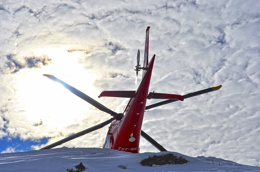 helicopter, clouds, backlight, rotor blades, rega, landing HD wallpaper