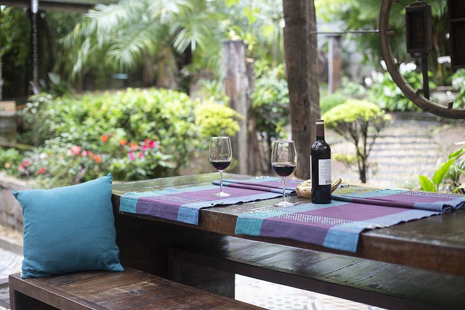 Wine Bottle and Glasses on Purple Mat, backyard, bench, blurred background HD wallpaper