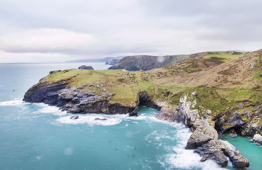 Aerial Photography of Island, beach, cliffs, clouds, cornish coast HD wallpaper