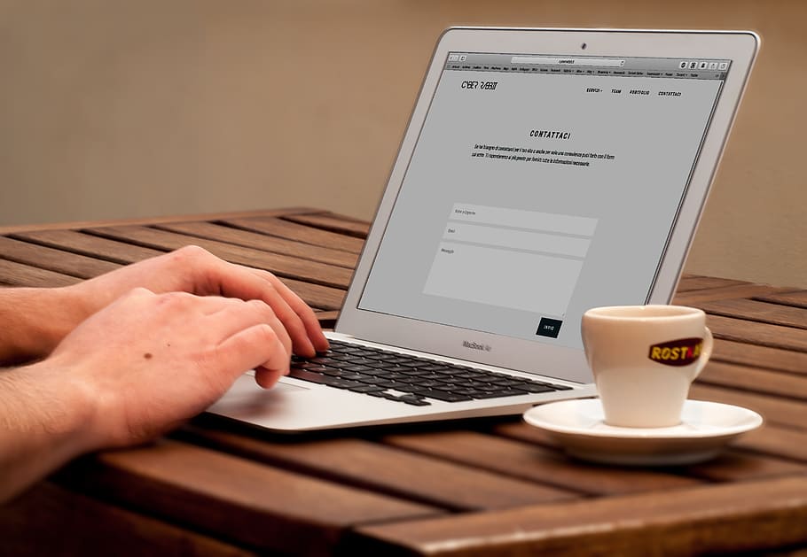 Human Using Laptop Beside Teacup on the Wooden Table, apple, coffee HD wallpaper