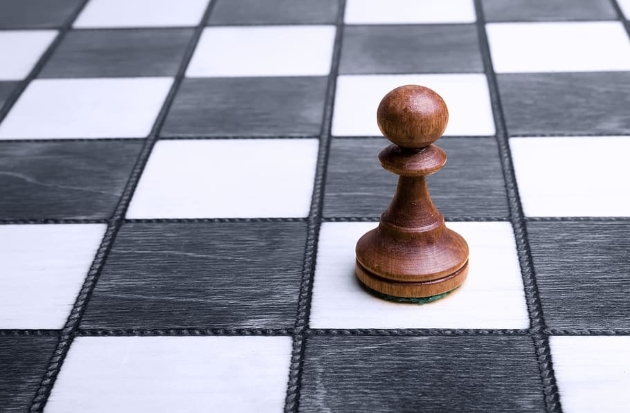 Chess Board With A Few Pieces Scattered On The Floor Background