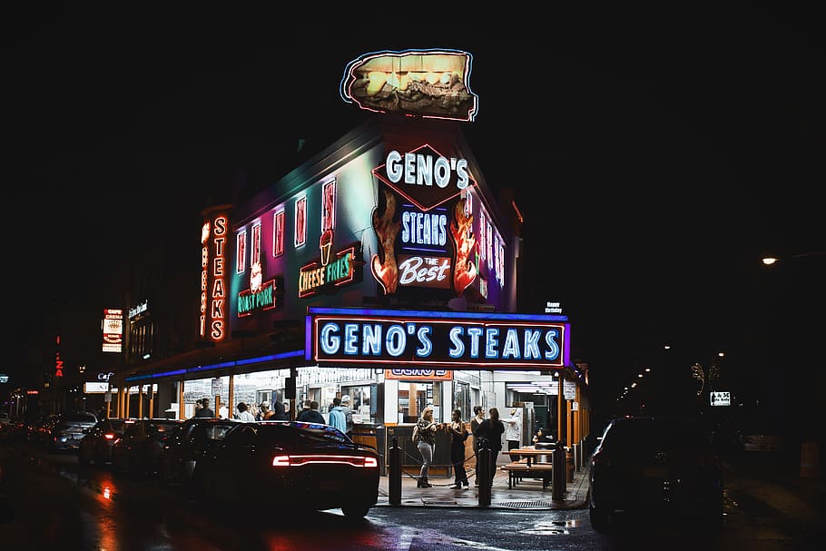 people standing and walking near Geno's steak building during nighttime, HD wallpaper