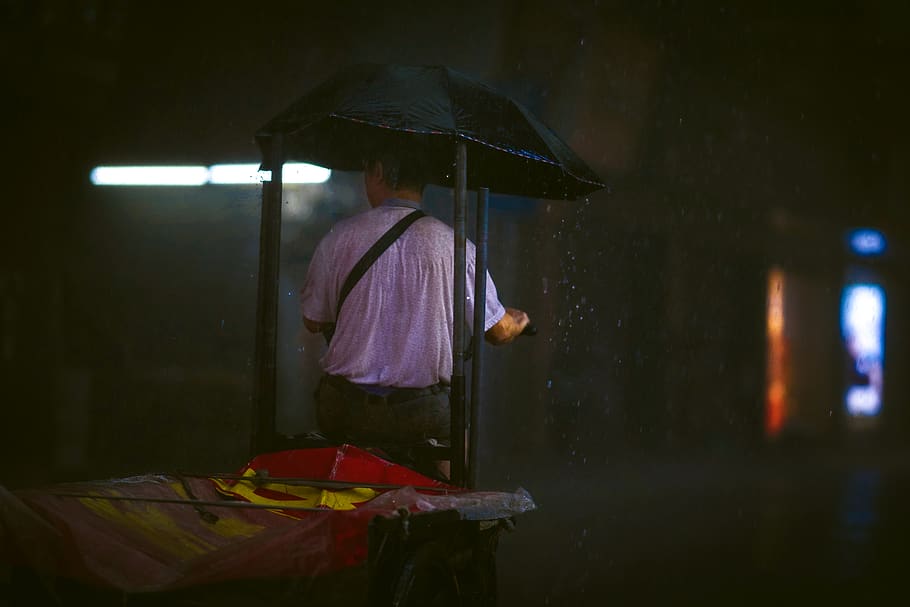 man in beige shirt stands under rain with black umbrella, person, HD wallpaper