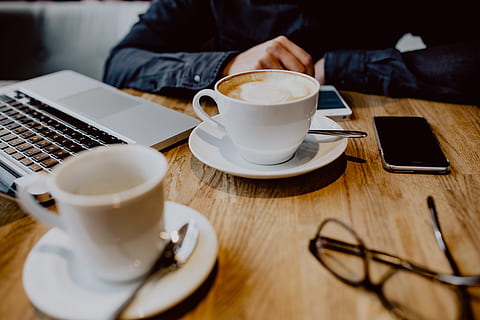 Cup of coffee on table in cafe, interior, tech, technology, work HD wallpaper