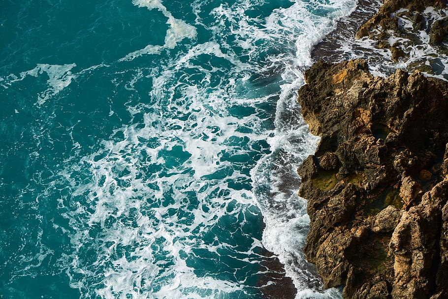 Aerial Photography of Body of Water Beside Rock Formation, background HD wallpaper