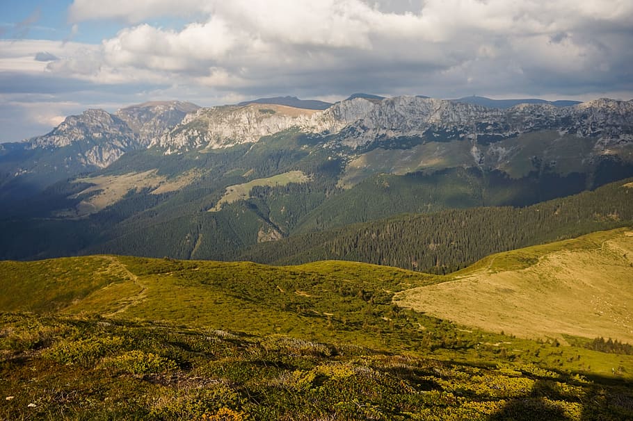 Green Mountain Range Under Cloudy Skies, adventure, clouds, dawn HD wallpaper