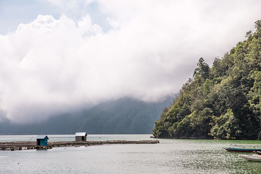 Oceanside mountains covered with clouds in Indonesia, asian, hut HD wallpaper