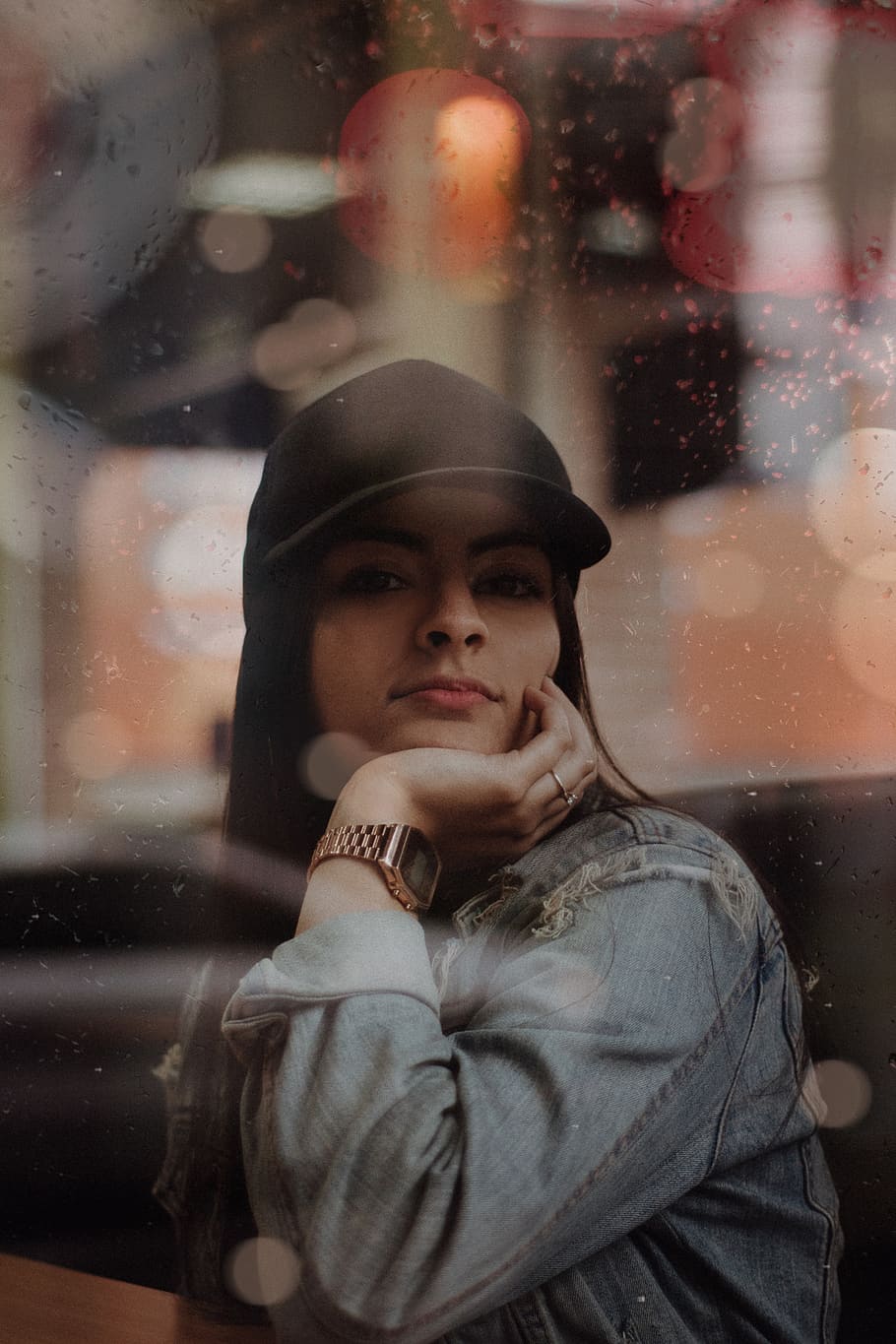 Selective focus photography of person wearing LA Dodgers cap