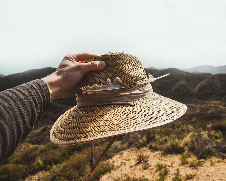 hat, straw hat, feather, hiking, human hand, one person, adult HD wallpaper