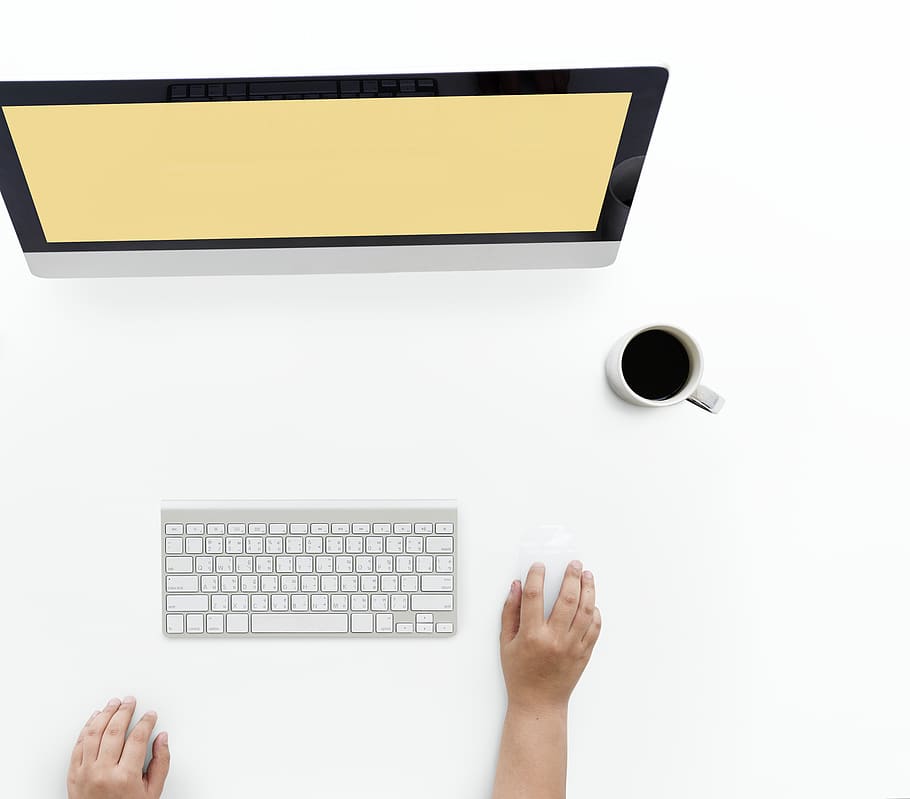 Person Using Apple Magic Mouse and Wireless Keyboard, coffee cup HD wallpaper