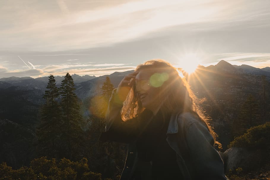 person in grey jacket smiling, light, flare, nature, sunlight HD wallpaper